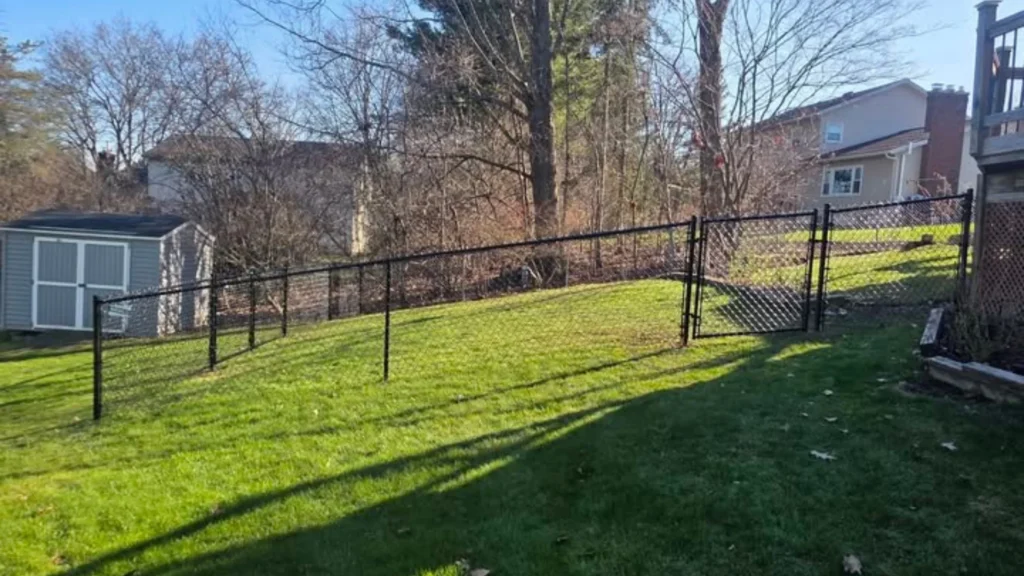 Black chain link fence installed by Mariaville Fence