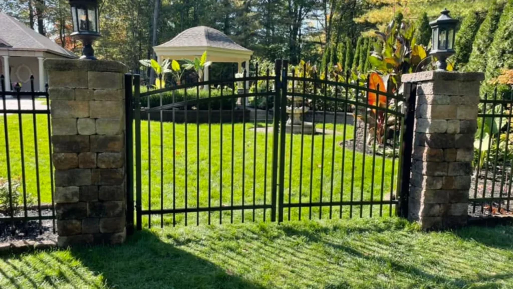 Black residential gate installed by Mariaville Fence in a backyard